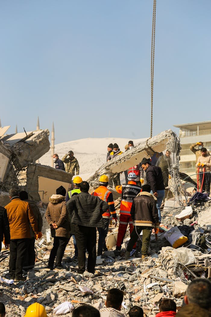 hero-homepage Rescue workers and civilians gathered on rubble after a devastating earthquake in Kahramanmaraş, Türkiye.